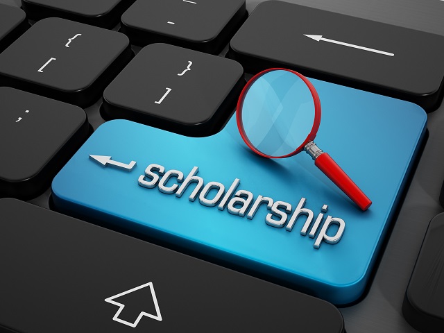 Scholarship word and magnifying glass on enter key